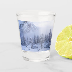 Winter wonderland, fog, spruce forest and mountain shot glass