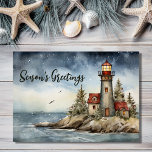 Wintery Lighthouse Season's Greetings Christmas Holiday Card<br><div class="desc">Celebrate the season with our Wintery Lighthouse Season's Greetings Christmas Holiday Card. The watercolor design captures the charm of a wintertime lighthouse scene, radiating warmth and nostalgia. Send your heartfelt wishes amidst the serene beauty of snowflakes and twinkling lights. Share joy and good tidings with this beautifully crafted card, a...</div>