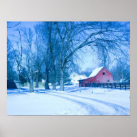 Wintery scene showing red barn in snow.