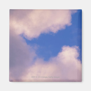 Wispy clouds against blue sky magnet