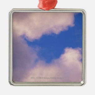Wispy clouds against blue sky metal ornament