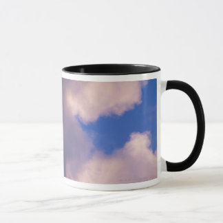 Wispy clouds against blue sky mug