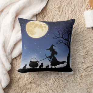 Witch brewing potions under a full moon at night cushion
