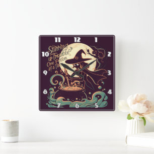 Witch creating potions under a glowing moon square wall clock