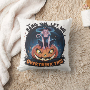 Witch perched on a pumpkin in a night sky cushion
