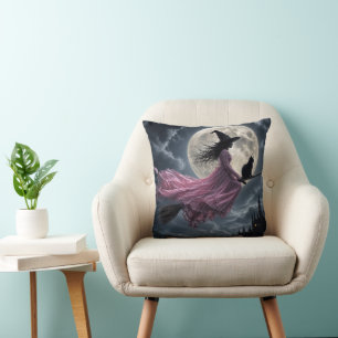 Witch Wearing a Pink Dress on a Broomstick Cushion