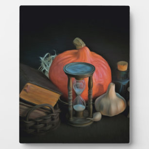 Witchery objects on a table in a dark room plaque