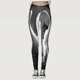 With black and white stylised swan image leggings