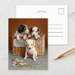 With Heaty Guud Wishes | Carl Reichert Postcard<br><div class="desc">With Heaty Guud Wishes | Carl Reichert’s With Hearty Good Wishes is a delightful painting featuring adorable puppies nestled together in a woven basket. Their curious expressions and soft fur are rendered with exquisite detail, exuding warmth and affection. The cosy composition, paired with the charming title, conveys a sense of...</div>