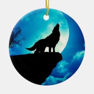 Wolf in silhouette howling to the full moon ceramic ornament