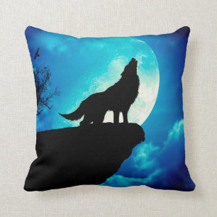 Wolf in silhouette howling to the full moon cushion