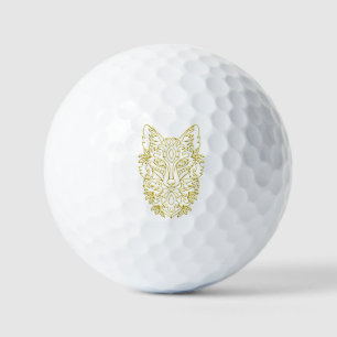 Wolf-like head art in gold golf balls