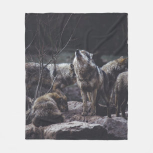 WOLF PACK ON ROCK FORMATION FLEECE BLANKET