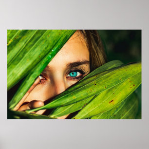 Woman behind green leaves poster