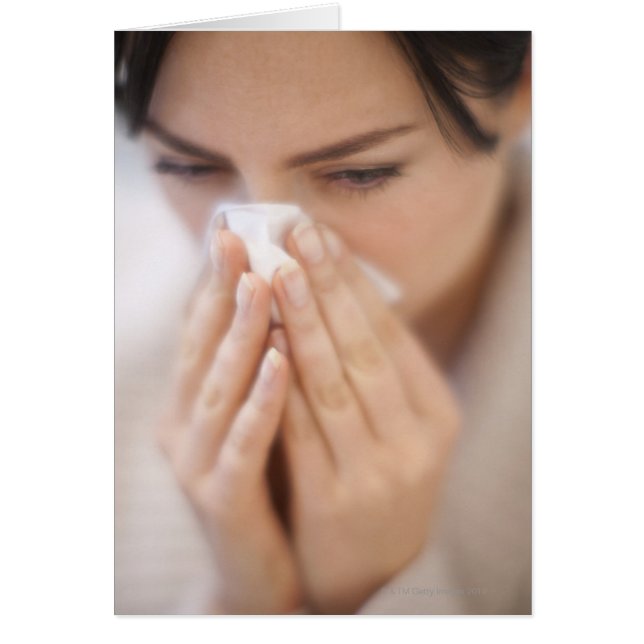 Woman blowing her nose. (Front)