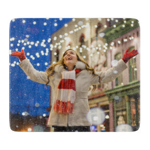 Woman Celebrates Christmas With Arms in the Air Cutting Board