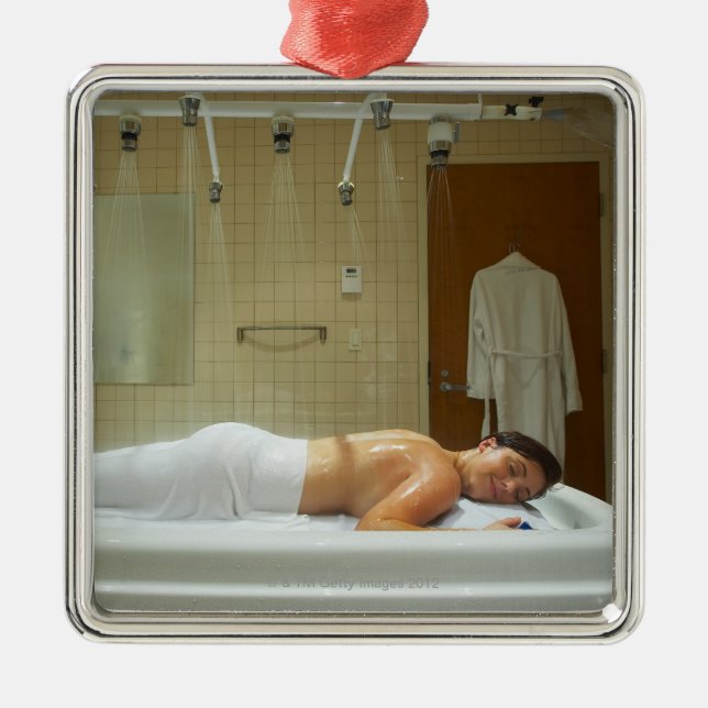 Woman enjoying hydrotherapy in vichy shower metal ornament (Front)