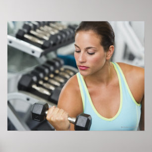 Woman exercising with dumbbells poster