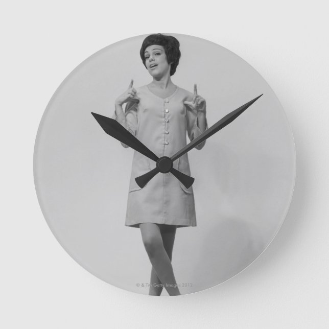 Woman Gesturing Round Clock (Front)