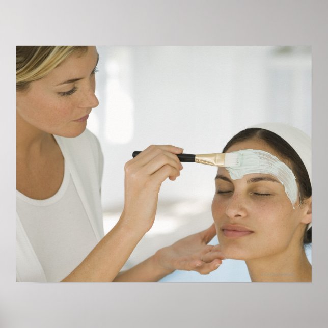 Woman getting beauty mud mask poster (Front)
