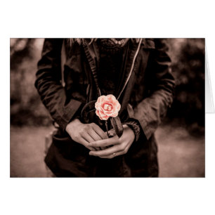 Woman Holding a Pink Camellia