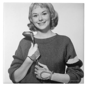 Woman Holding Golf Club Tile