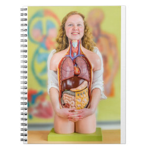 Woman holding human body with internal organs.JPG Notebook