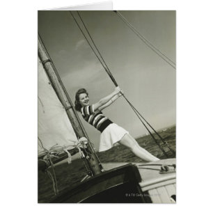 Woman Holding Rigging on Yacht