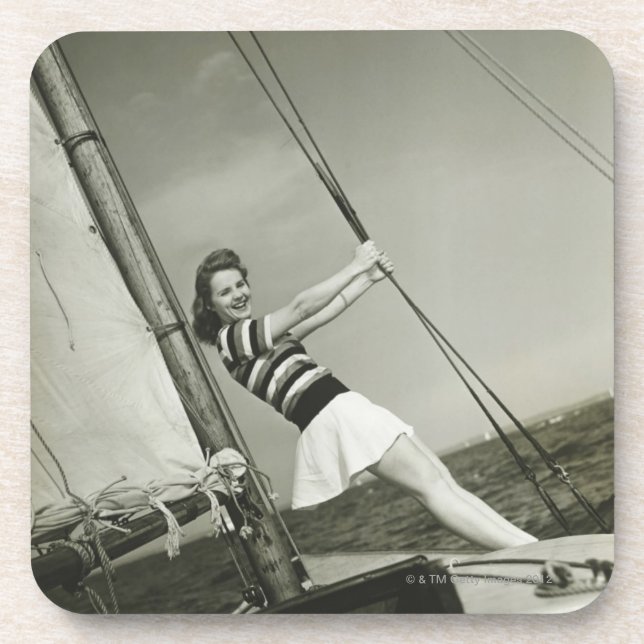 Woman Holding Rigging on Yacht Coaster (Front)