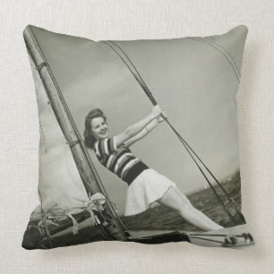 Woman Holding Rigging on Yacht Cushion