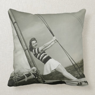 Woman Holding Rigging on Yacht Cushion