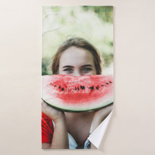 Woman holding sliced watermelon bath towel