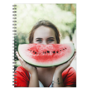 Woman holding sliced watermelon notebook
