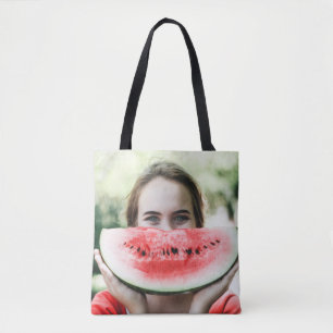 Woman holding sliced watermelon tote bag