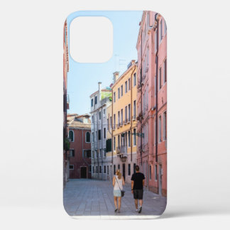 Woman in black jacket walking on sidewalk in the m iPhone 12 case