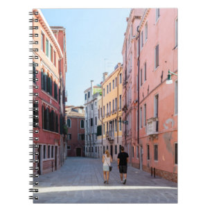 Woman in black jacket walking on sidewalk in the m notebook