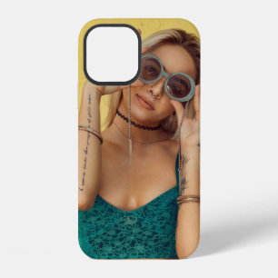 Woman in blue bralette holding sunglasses putting  iPhone 12 case