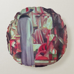 Woman in front of a large illuminated window round cushion