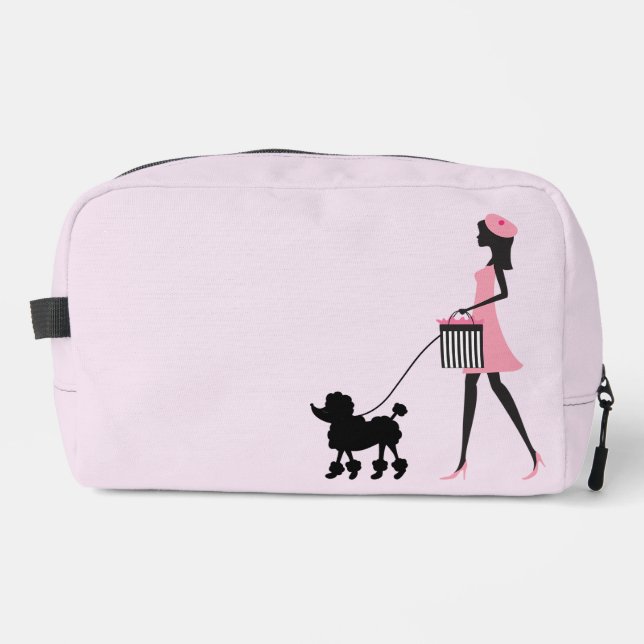 Woman in pink walking black poodle  dopp kit (Front)