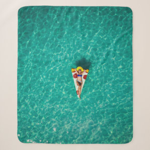 Woman in pizza float sherpa blanket
