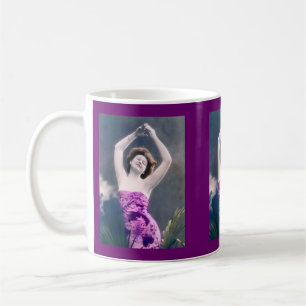 woman in purple sarong , arms raised as if dancing coffee mug