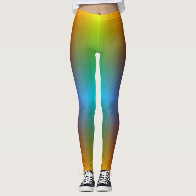 Woman in rainbow gradient leggings with a subtle  (Front)