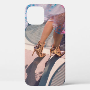 Woman in white pink and green floral skirt and bro iPhone 12 case