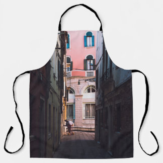 WOMAN IN WHITE SHIRT AND BLACK PANTS WALKING ON SI APRON