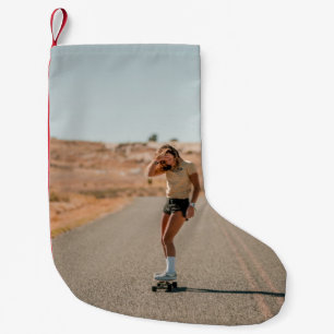 Woman in white shirt running on road in the mornin small christmas stocking