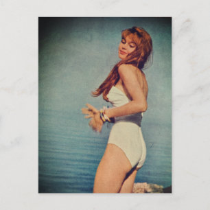 Woman in White Swimsuit on the beach in 1957 Postcard