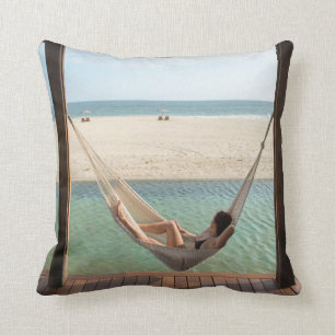 Woman Laying On A Hammock At A Small Hotel Cushion