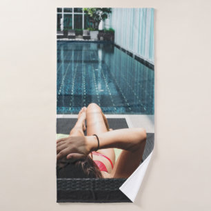 Woman laying on brown chaise lounge bath towel