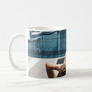 Woman laying on brown chaise lounge coffee mug