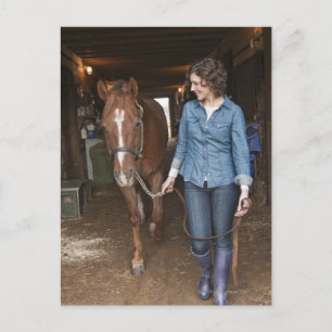 Woman leading horse postcard
